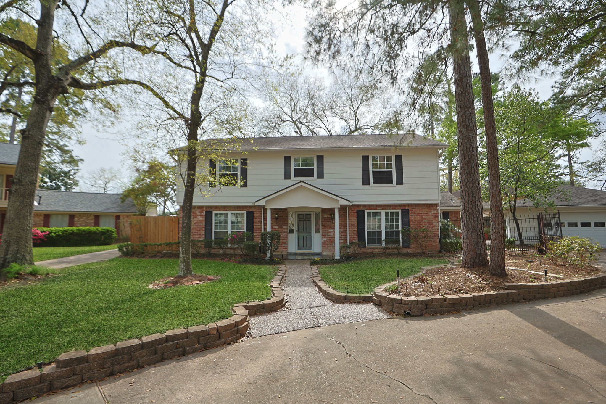 17507 Oxhill Court Spring, TX 77388 - Photo 2 of 44 Extensive flower beds in the front and back yards enhance the natural beauty of the lot. Look closely and you'll see plants just starting to emerge!