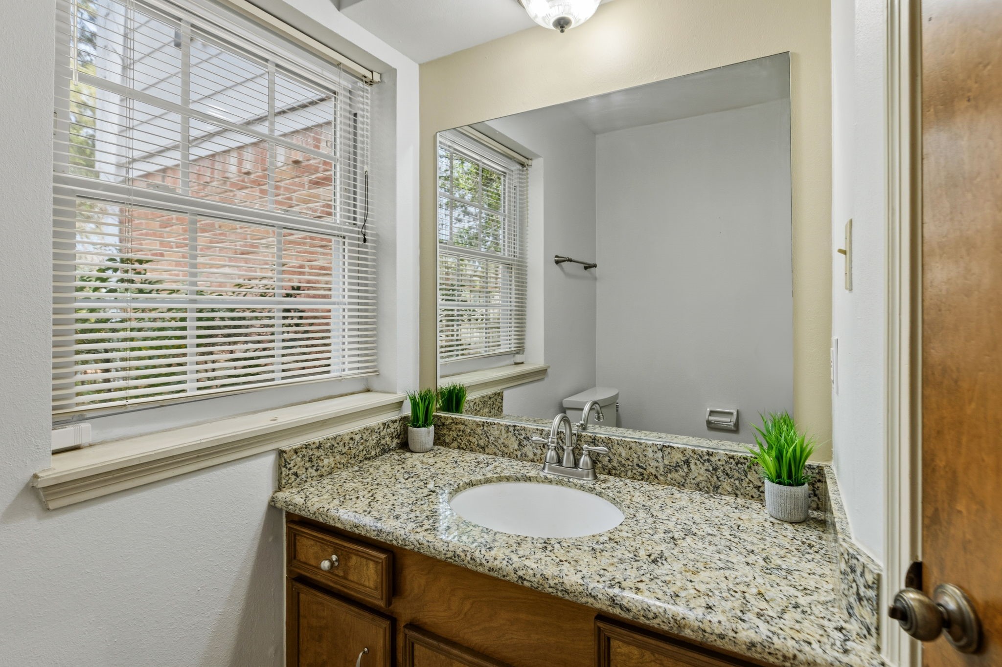 17507 Oxhill Court Spring, TX 77388 - Photo 21 of 44 This half bath is near the side door and utility room.