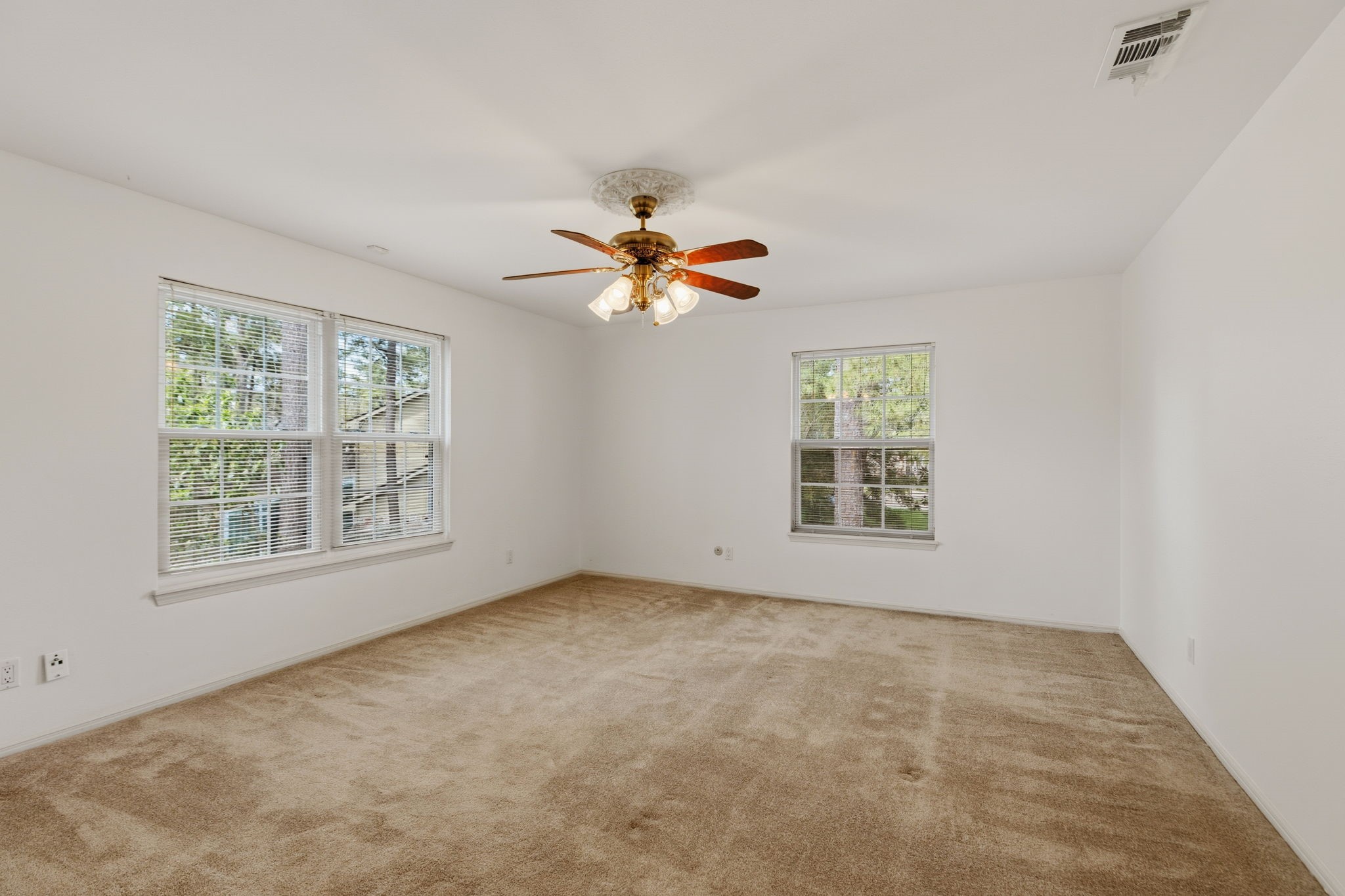 17507 Oxhill Court Spring, TX 77388 - Photo 22 of 44 The primary bedroom has lots of natural light from the windows.