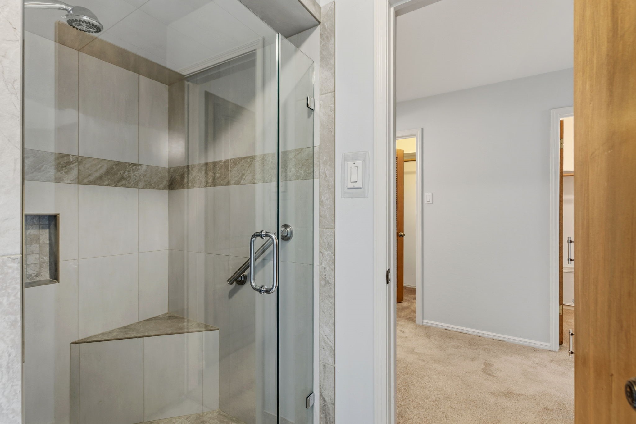 17507 Oxhill Court Spring, TX 77388 - Photo 25 of 44 The primary shower has a seat and a grab bar.