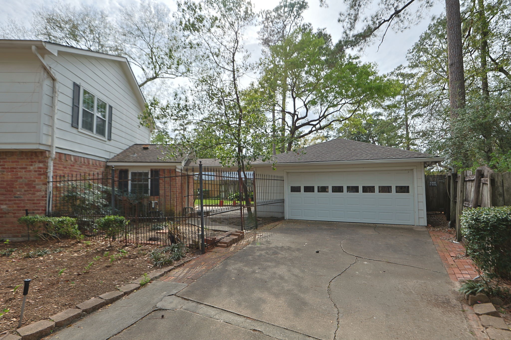 17507 Oxhill Court Spring, TX 77388 - Photo 3 of 44 The detached garage has a covered walkway that leads into the utility room of the home. It is also fenced off into the backyard.