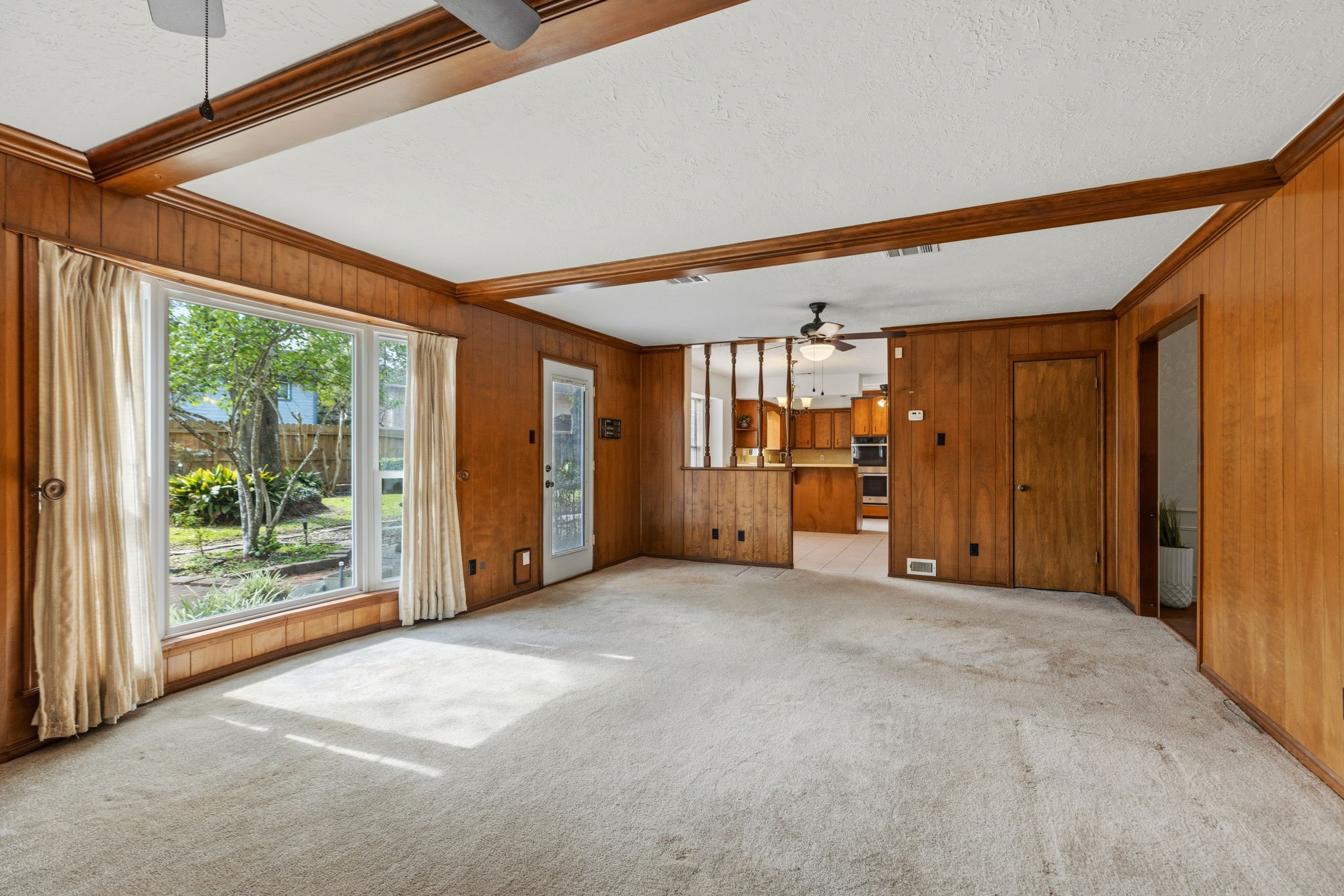 17507 Oxhill Court Spring, TX 77388 - Photo 10 of 44 The family room has a lovely view into the backyard, and the breakfst area and kitchen are beyond.