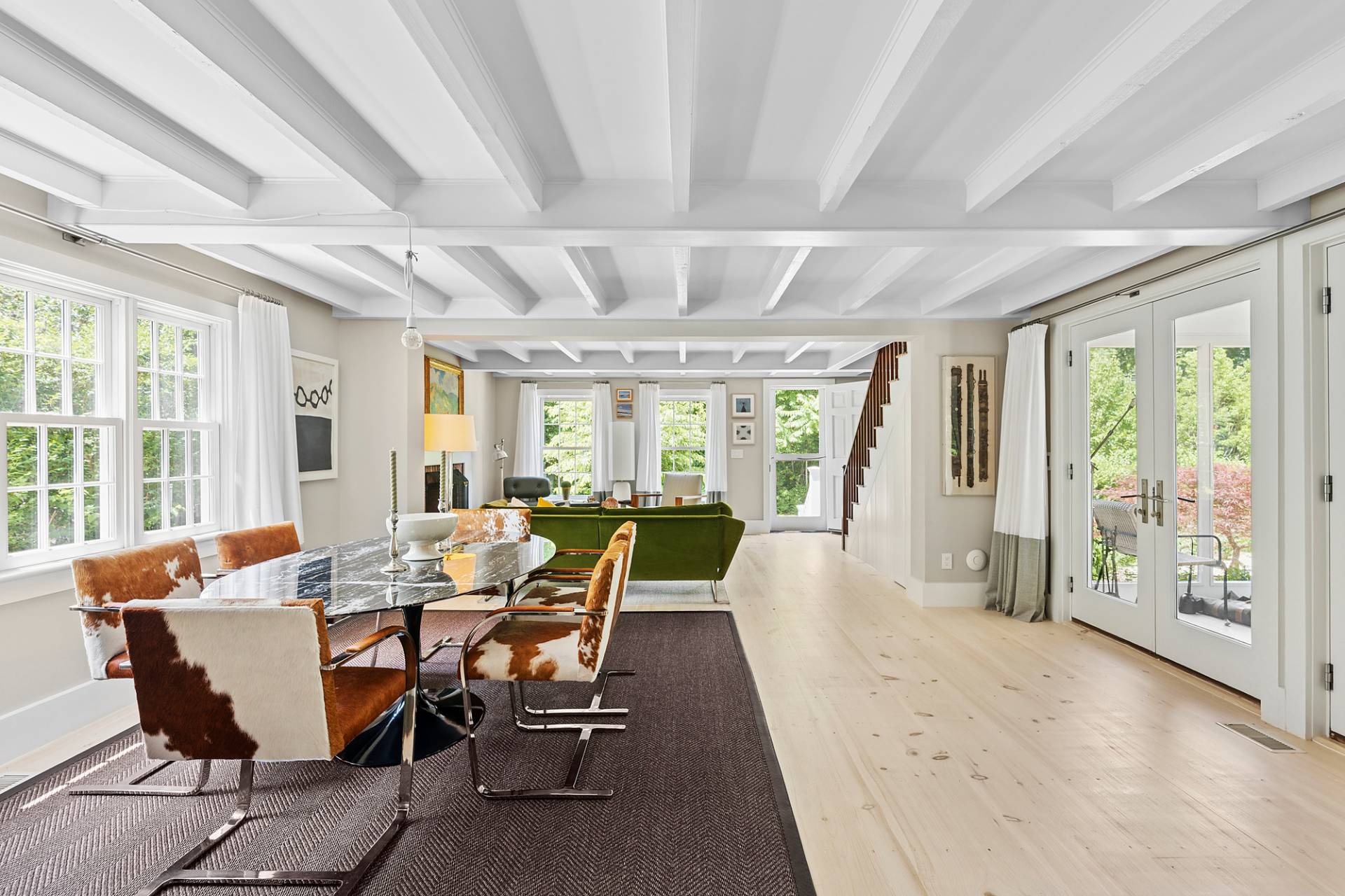 8 Fresh Pond Road Sag Harbor, NY 11963 - Photo 11 of 40 a view of a dining room with furniture large windows and wooden floor