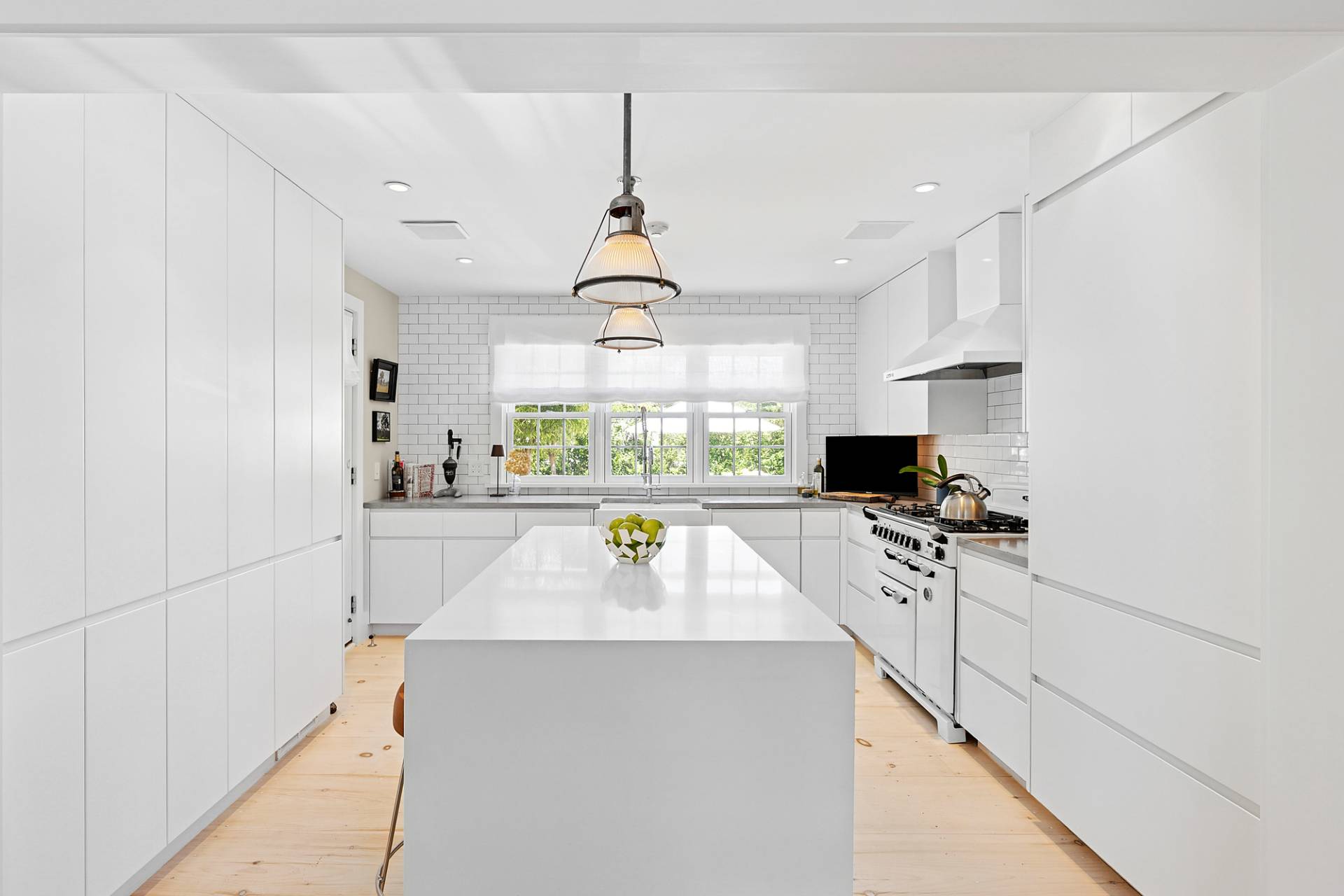 8 Fresh Pond Road Sag Harbor, NY 11963 - Photo 21 of 40 a kitchen with stainless steel appliances a sink a stove a refrigerator and cabinets