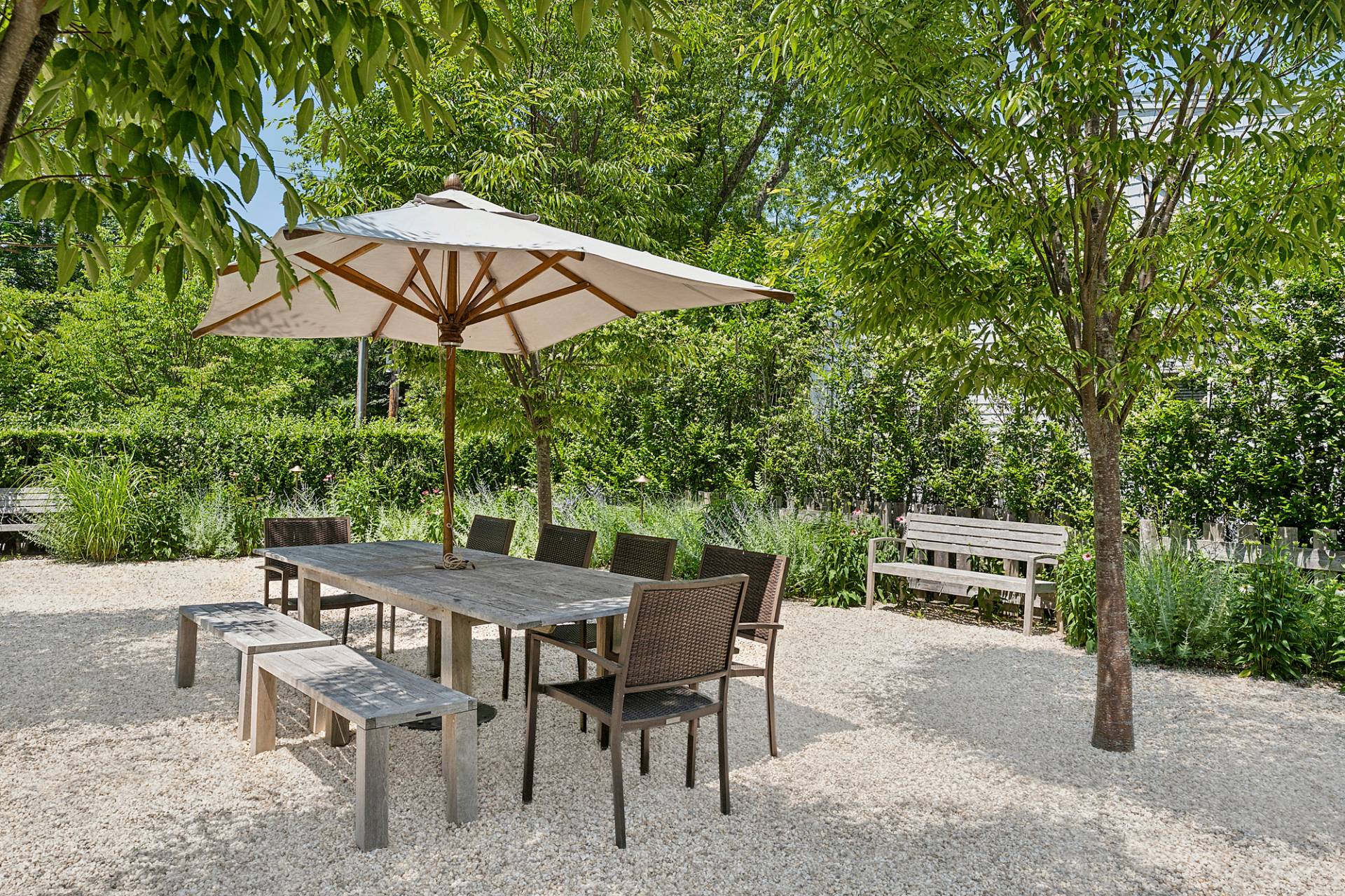 8 Fresh Pond Road Sag Harbor, NY 11963 - Photo 23 of 40 an outdoor space with furniture and umbrella