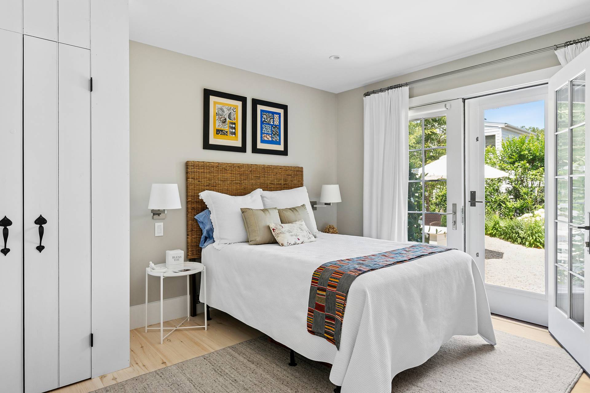 8 Fresh Pond Road Sag Harbor, NY 11963 - Photo 24 of 40 a bedroom with a large bed and a large window