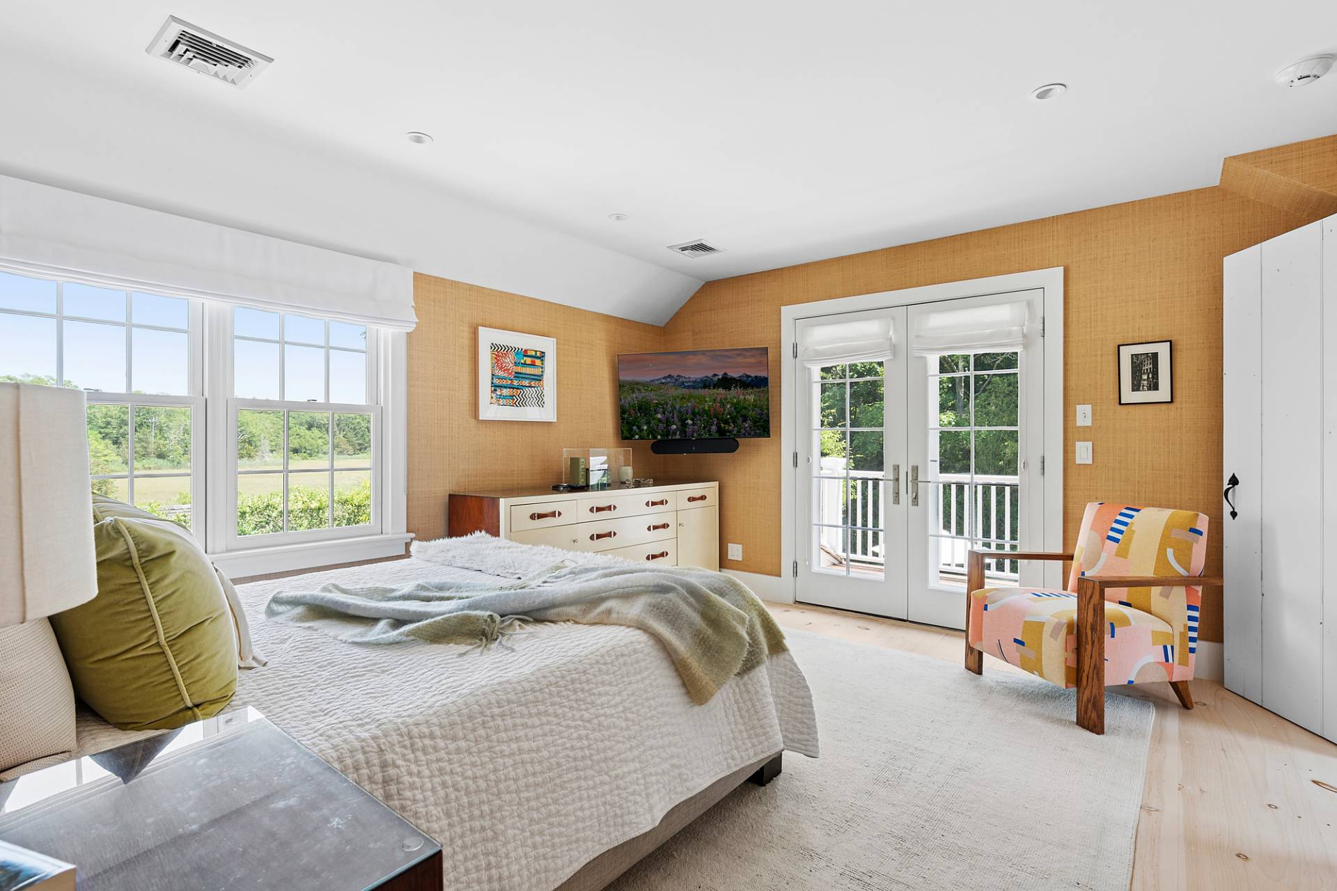 8 Fresh Pond Road Sag Harbor, NY 11963 - Photo 28 of 40 a bedroom with a bed and glass door
