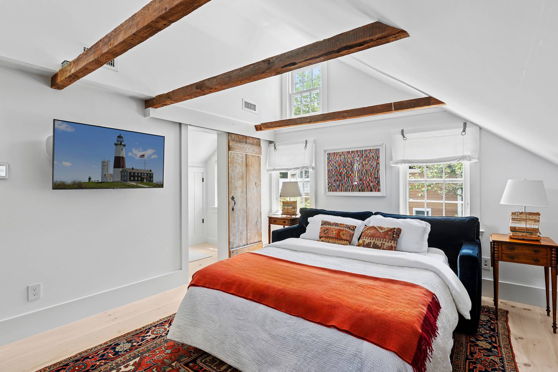 8 Fresh Pond Road Sag Harbor, NY 11963 - Photo 35 of 40 a bedroom with a bed and wooden floor