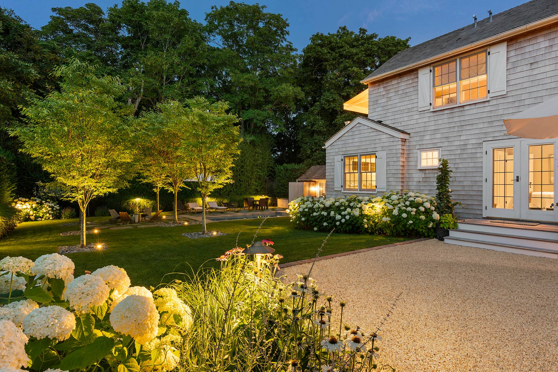 8 Fresh Pond Road Sag Harbor, NY 11963 - Photo 38 of 40 a front view of a house with a garden and pathway