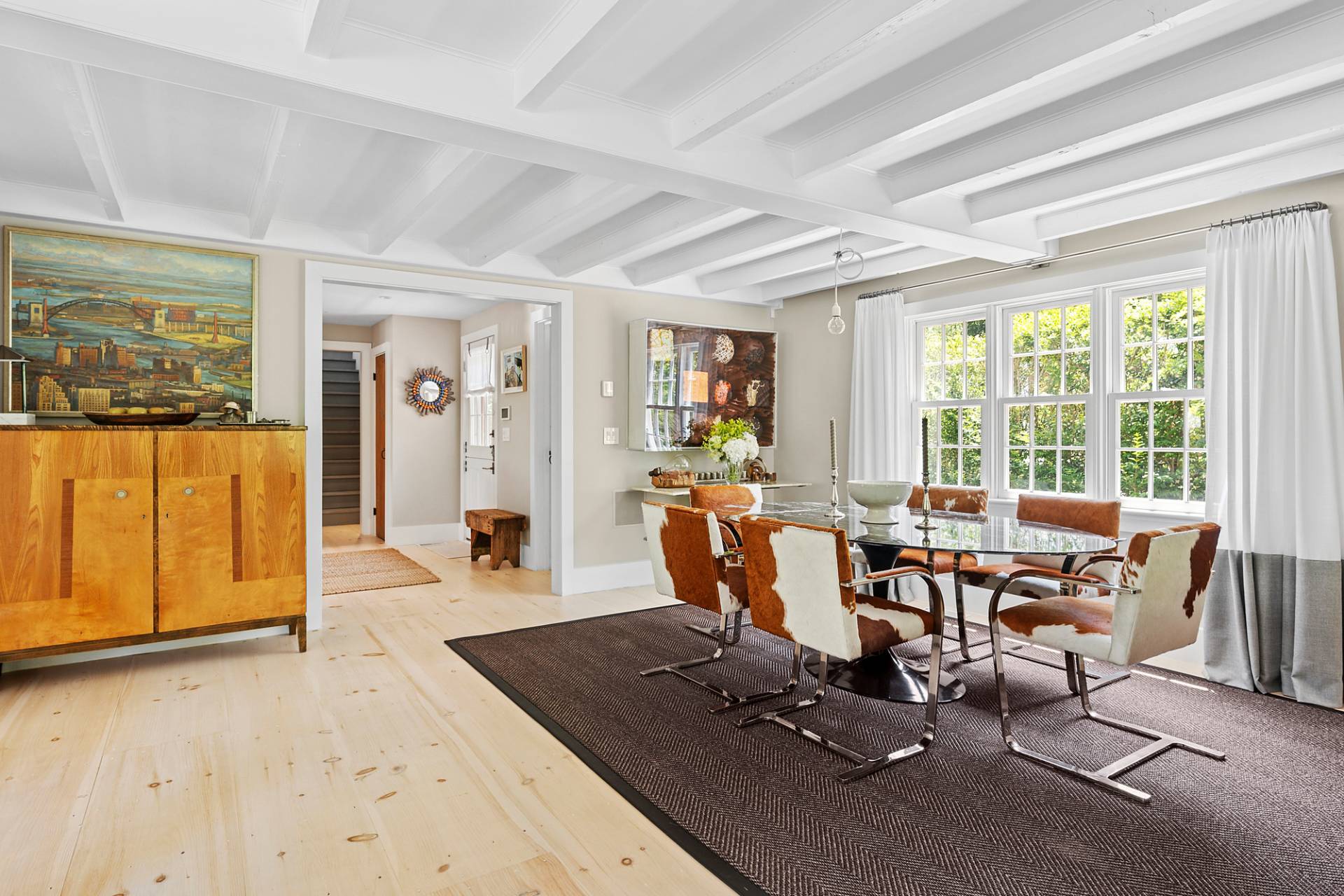 8 Fresh Pond Road Sag Harbor, NY 11963 - Photo 10 of 40 a living room with furniture a large window and wooden floor