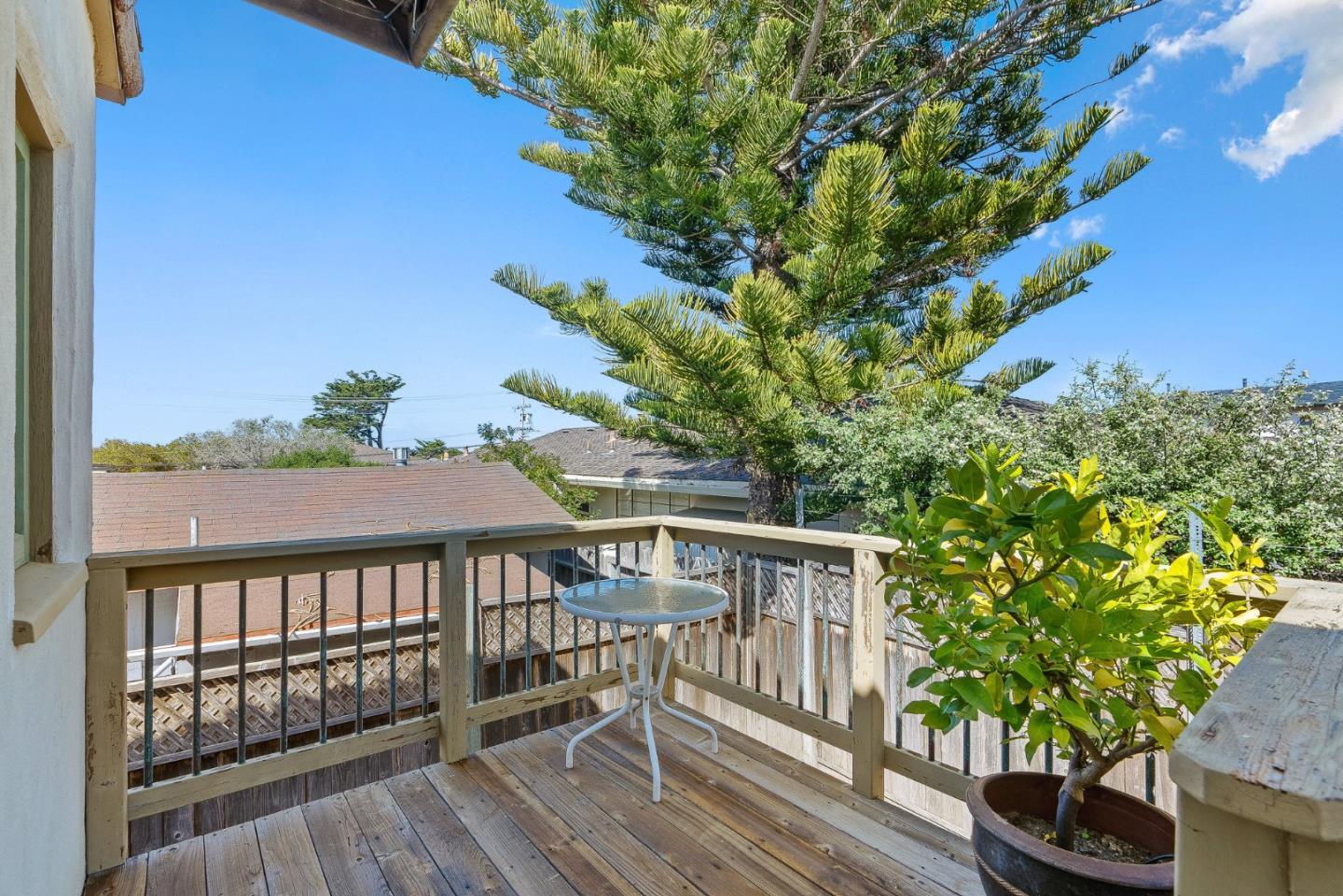 925 Cass Street Monterey, CA 93940 - Photo 8 of 27 a view of a wooden chairs and table in the balcony