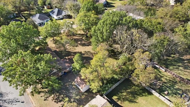 a backyard of a house with lots of trees