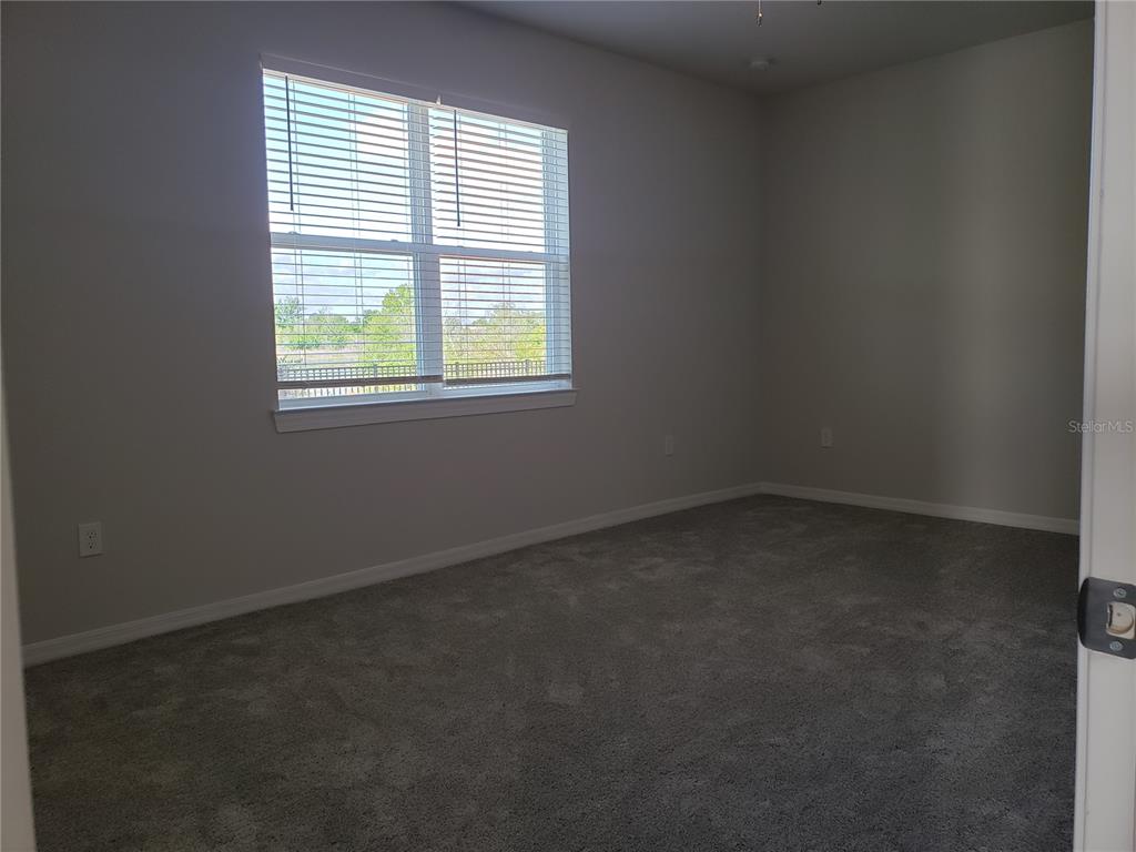 17244 Cagan Crossings Boulevard Clermont, FL 34714 - Photo 11 of 14 an empty room with a window