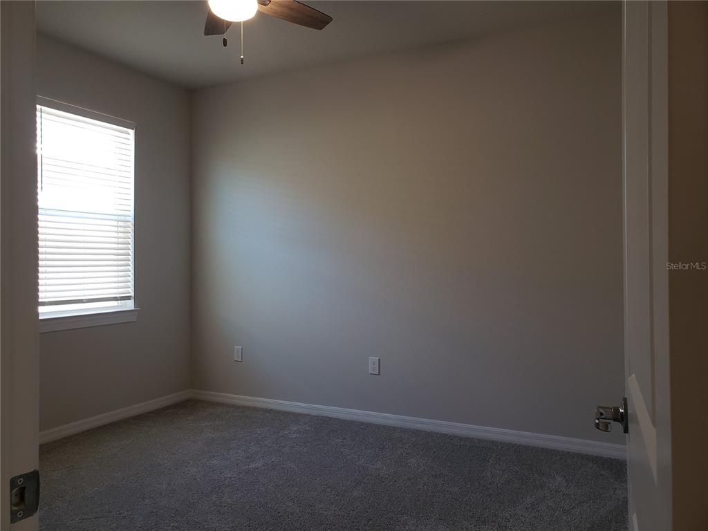 17244 Cagan Crossings Boulevard Clermont, FL 34714 - Photo 6 of 14 an empty room with a window