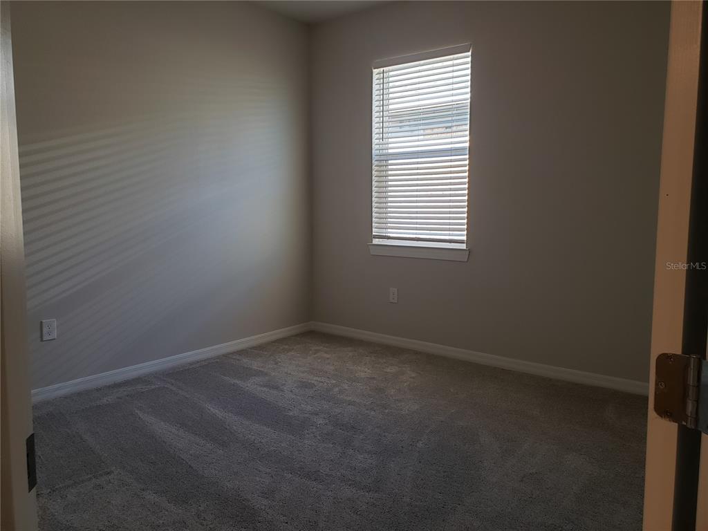 17244 Cagan Crossings Boulevard Clermont, FL 34714 - Photo 10 of 14 an empty room with a window