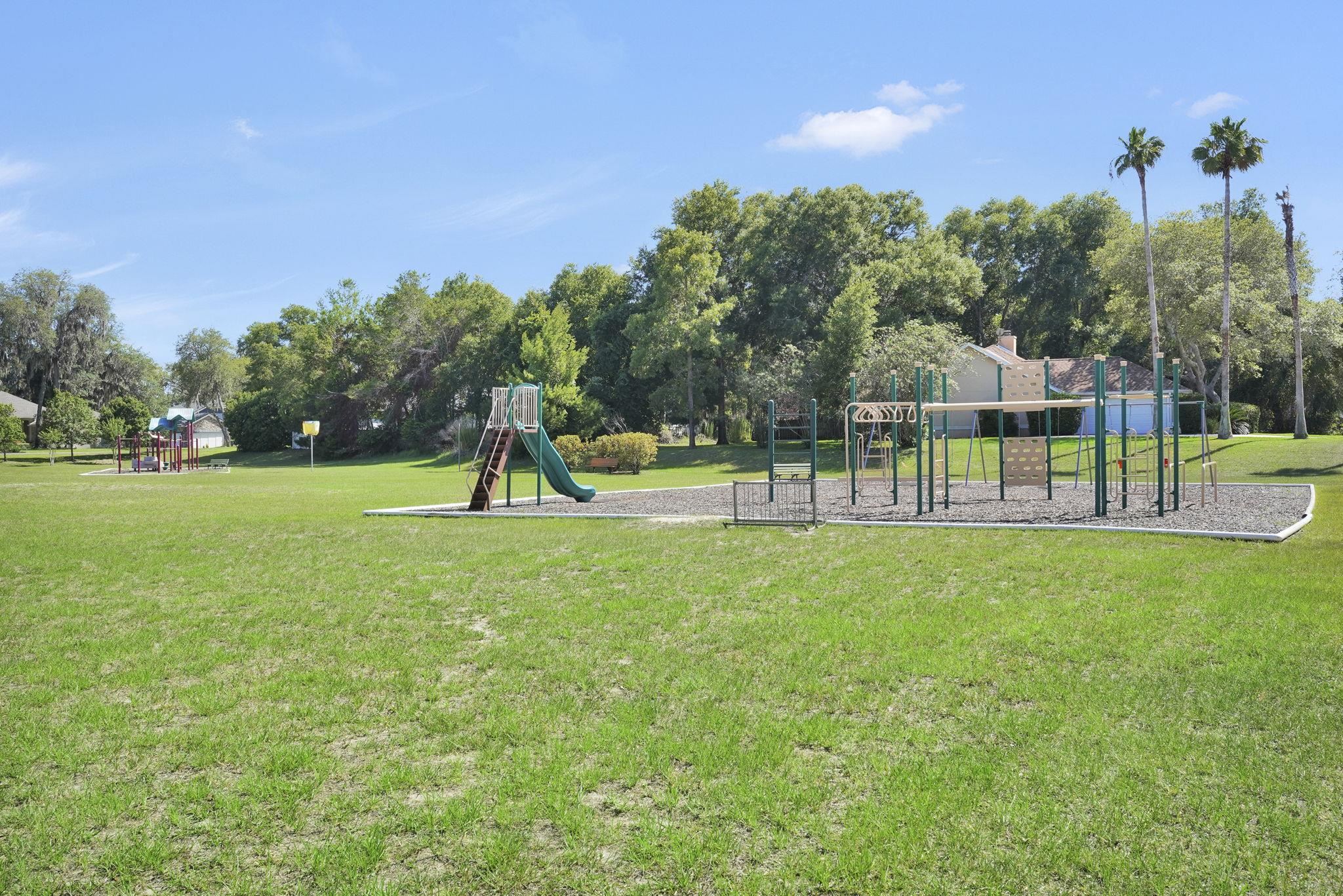 3372 Kings Road South St. Augustine, FL 32086 - Photo 36 of 48 a view of a park with swings and slides
