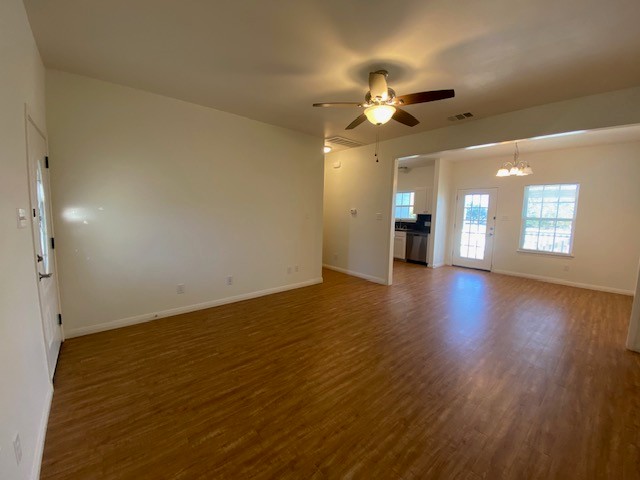 112 Palmo Drive Luling, TX 78648 - Photo 11 of 24 a view of an empty room with a window and wooden floor