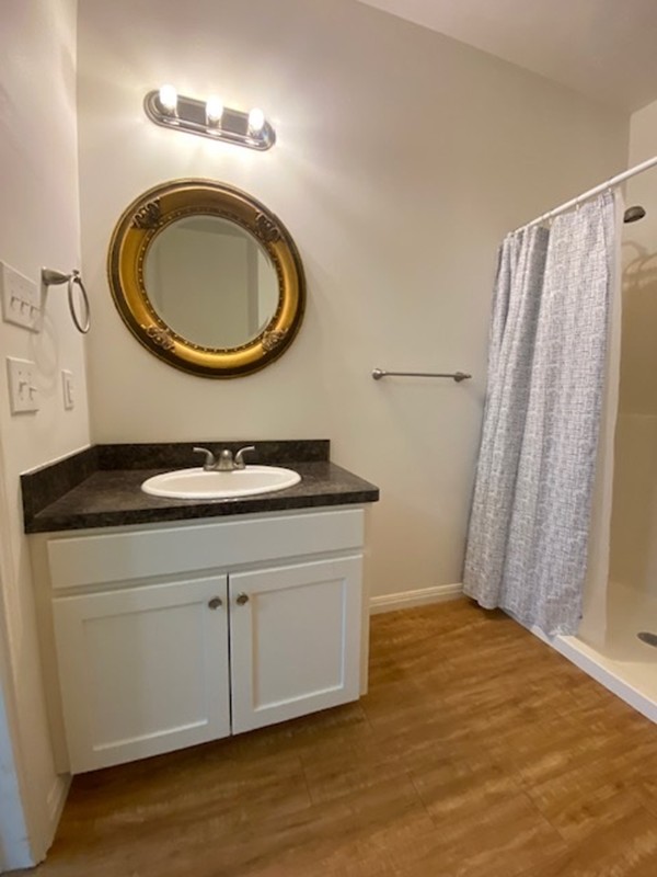 112 Palmo Drive Luling, TX 78648 - Photo 8 of 24 a bathroom with a sink a mirror and a toilet