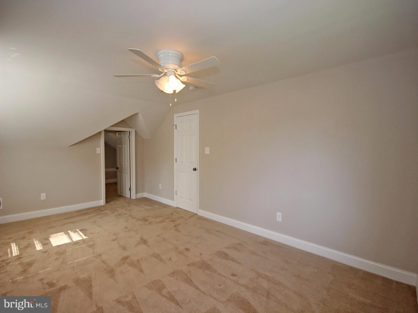 449 Pinecrest Road Springfield, PA 19064 - Photo 12 of 25 an empty room with windows and fan
