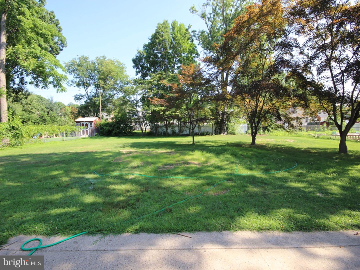 449 Pinecrest Road Springfield, PA 19064 - Photo 24 of 25 a view of grassy field with benches and trees all around