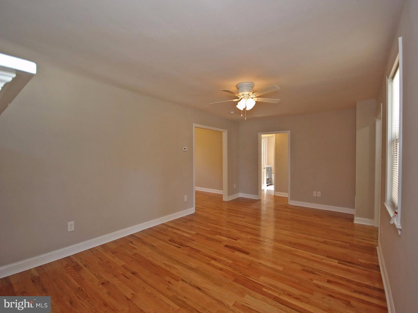 449 Pinecrest Road Springfield, PA 19064 - Photo 4 of 25 a view of an empty room with wooden floor and a window