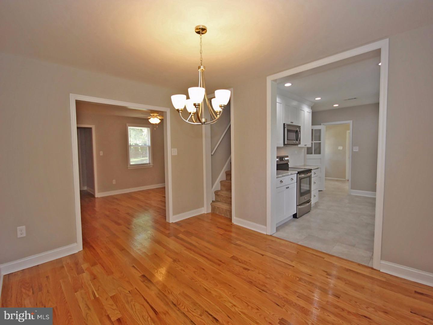 449 Pinecrest Road Springfield, PA 19064 - Photo 6 of 25 a view of a livingroom with a furniture wooden floor and a chandelier