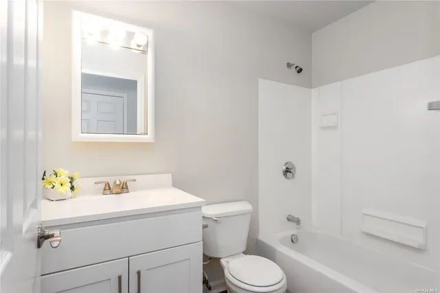 a bathroom with a sink toilet and bathtub