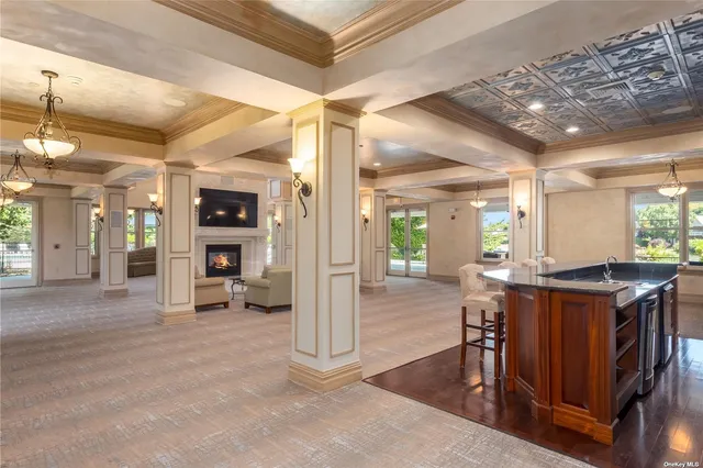 a view of a livingroom with furniture and a kitchen