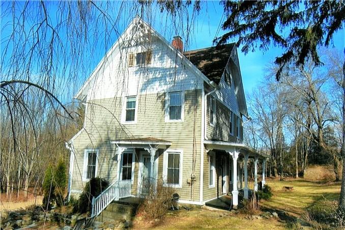 29 Tamarack Road New Milford, CT 06776 - Photo 1 of 1 a front view of a house with a yard