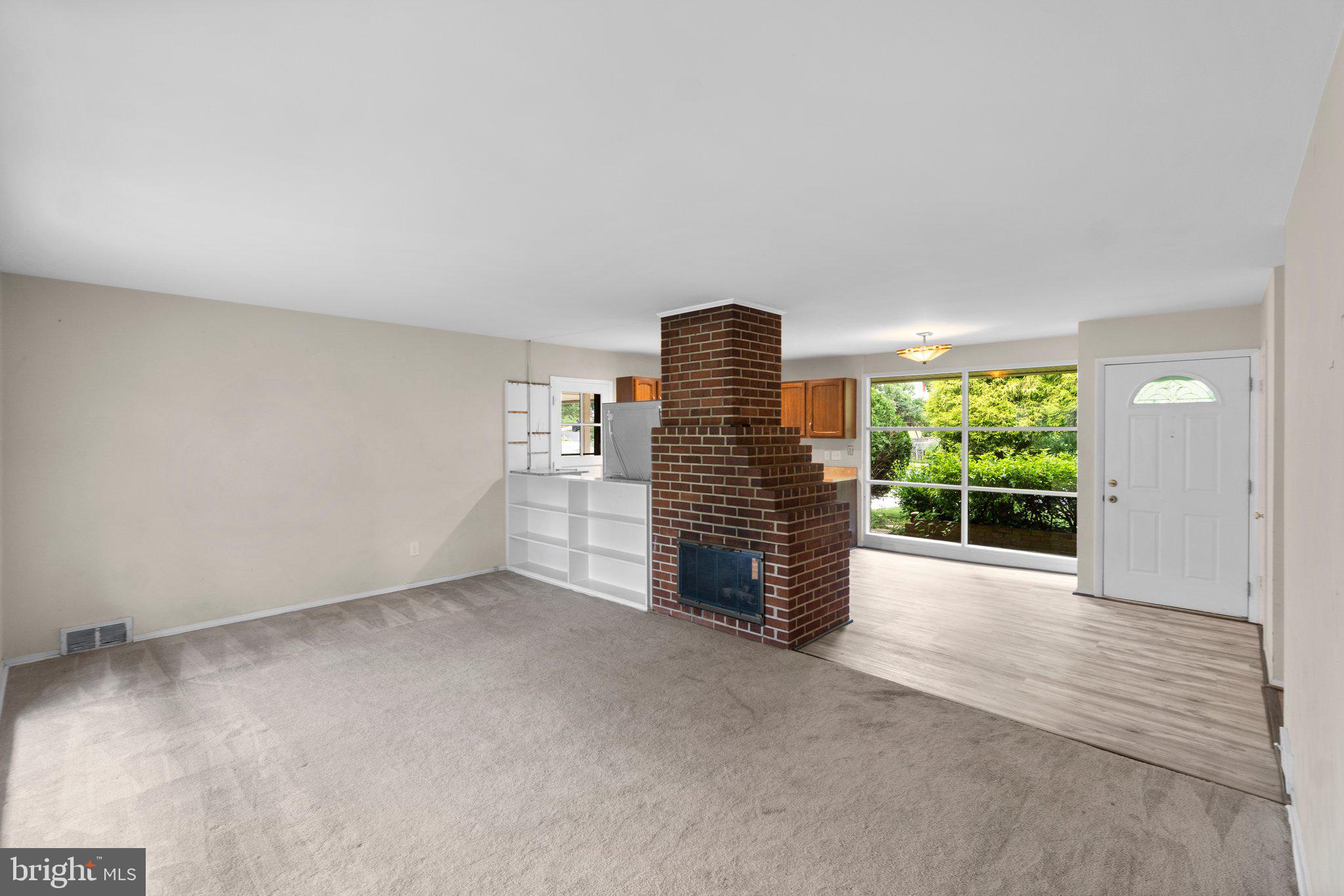 7303 Foxe Place Springfield, VA 22151 - Photo 11 of 38 Family room with double sided brick fireplace