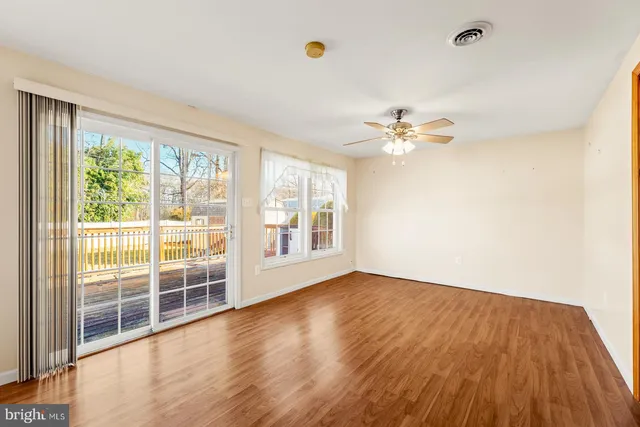 a kitchen with granite countertop a stove a sink and a refrigerator