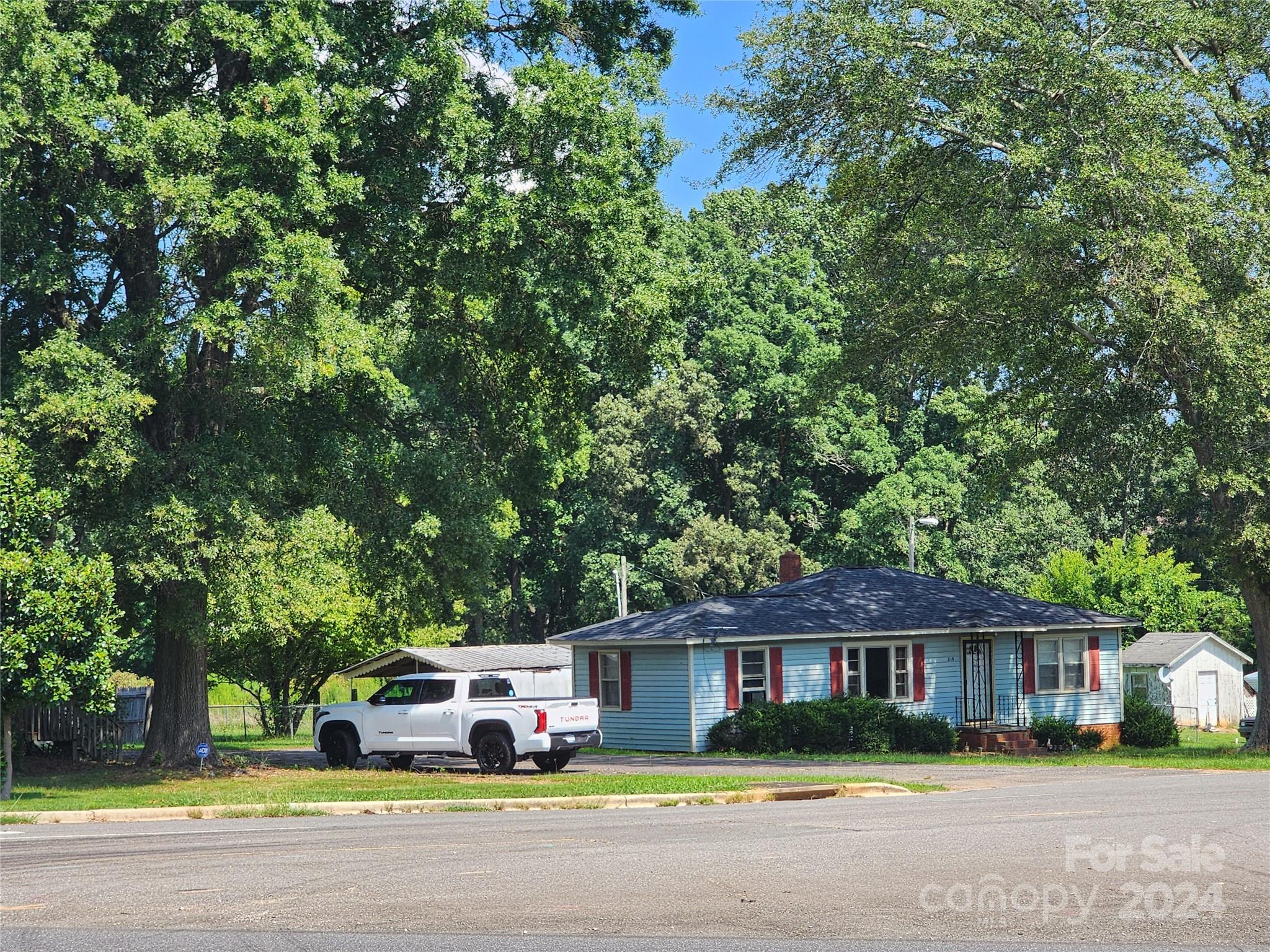 3708 Celanese Road Rock Hill, SC 29732 - Photo 22 of 45 a front view of a house with a yard and green space