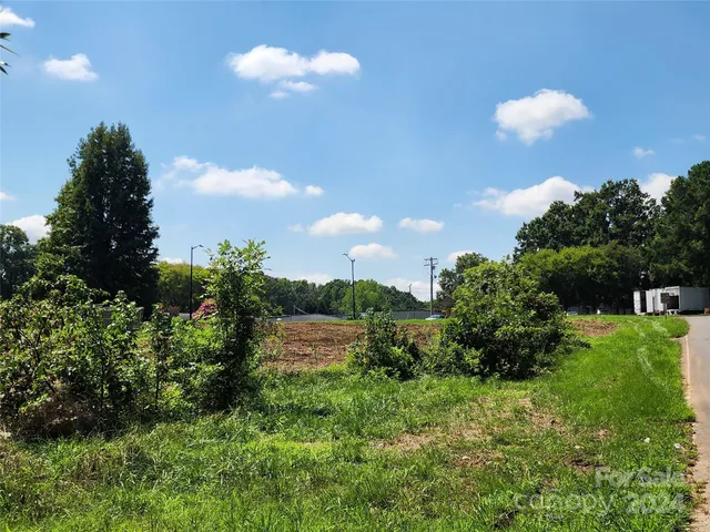 a view of a road with a building in the background
