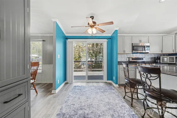 a view of a dining room with furniture window and outside view