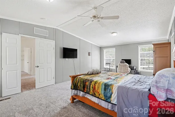a spacious bathroom with a granite countertop sink and a mirror