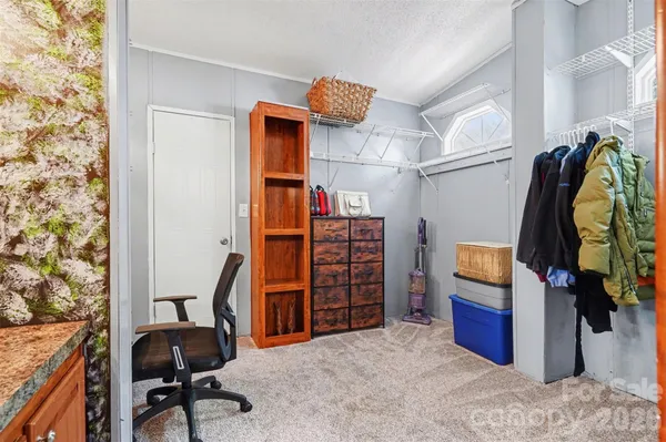 a workspace with furniture and a window