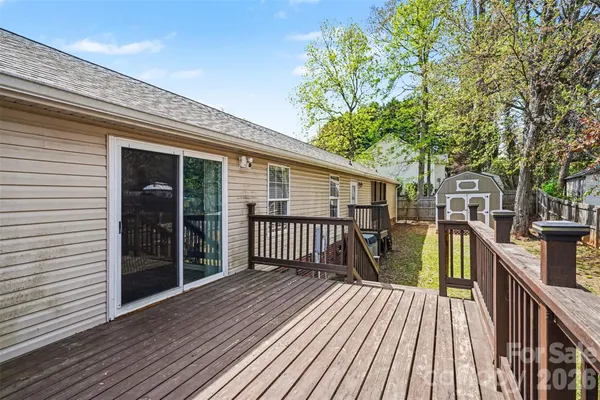 a view of balcony and deck with wooden floor and fence