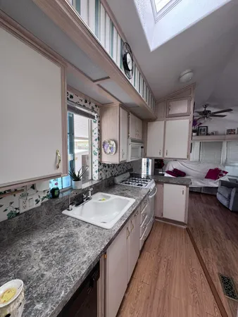 a bathroom with a sink toilet and a mirror