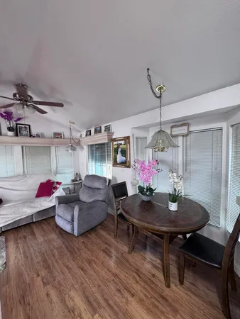 a living room with furniture and a table