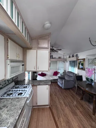 a kitchen that has a lot of cabinets in it