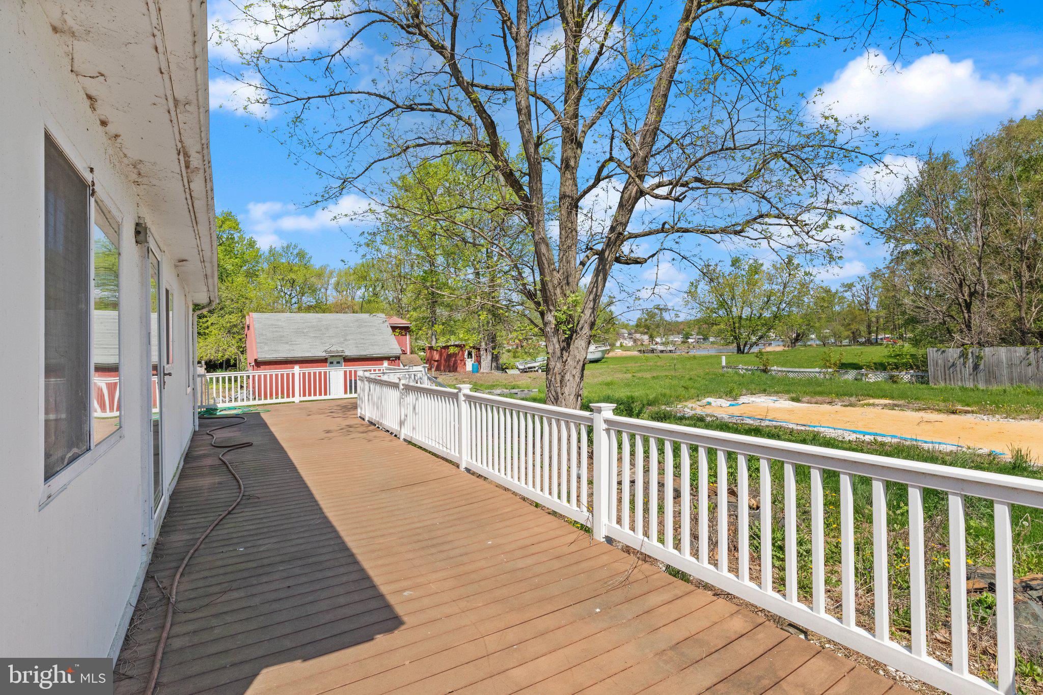 1047 Bowleys Quarters Road Middle River, MD 21220 - Photo 14 of 38 a view of balcony with wooden floor and fence