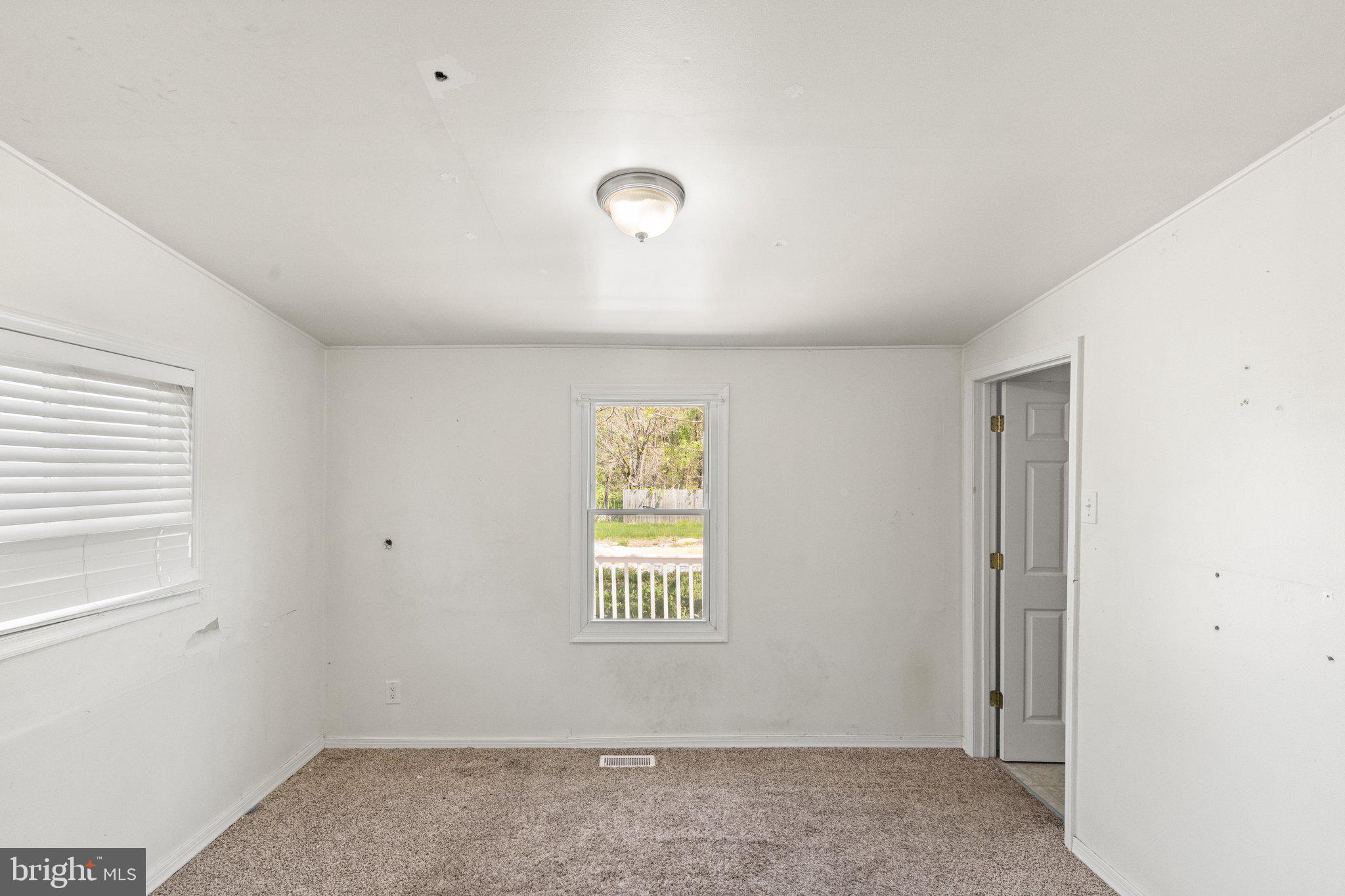 1047 Bowleys Quarters Road Middle River, MD 21220 - Photo 21 of 38 a view of an empty room with a window