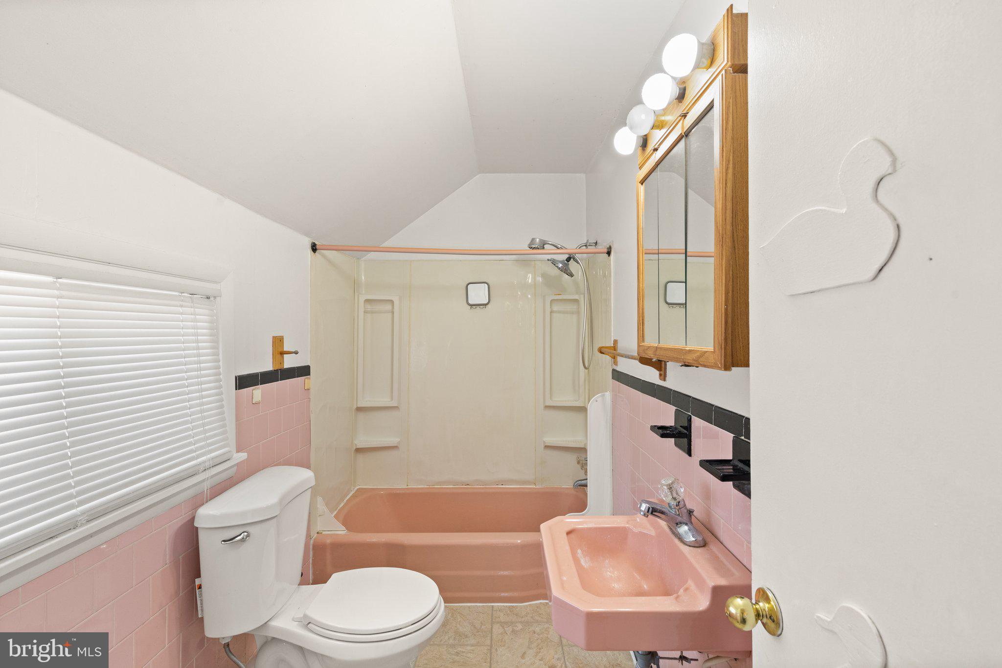 1047 Bowleys Quarters Road Middle River, MD 21220 - Photo 33 of 38 a bathroom with a sink a toilet and shower curtain