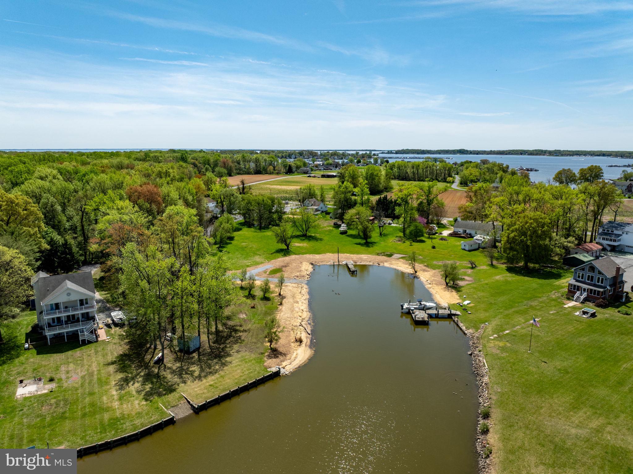 1047 Bowleys Quarters Road Middle River, MD 21220 - Photo 5 of 38 a view of a lake with a yard
