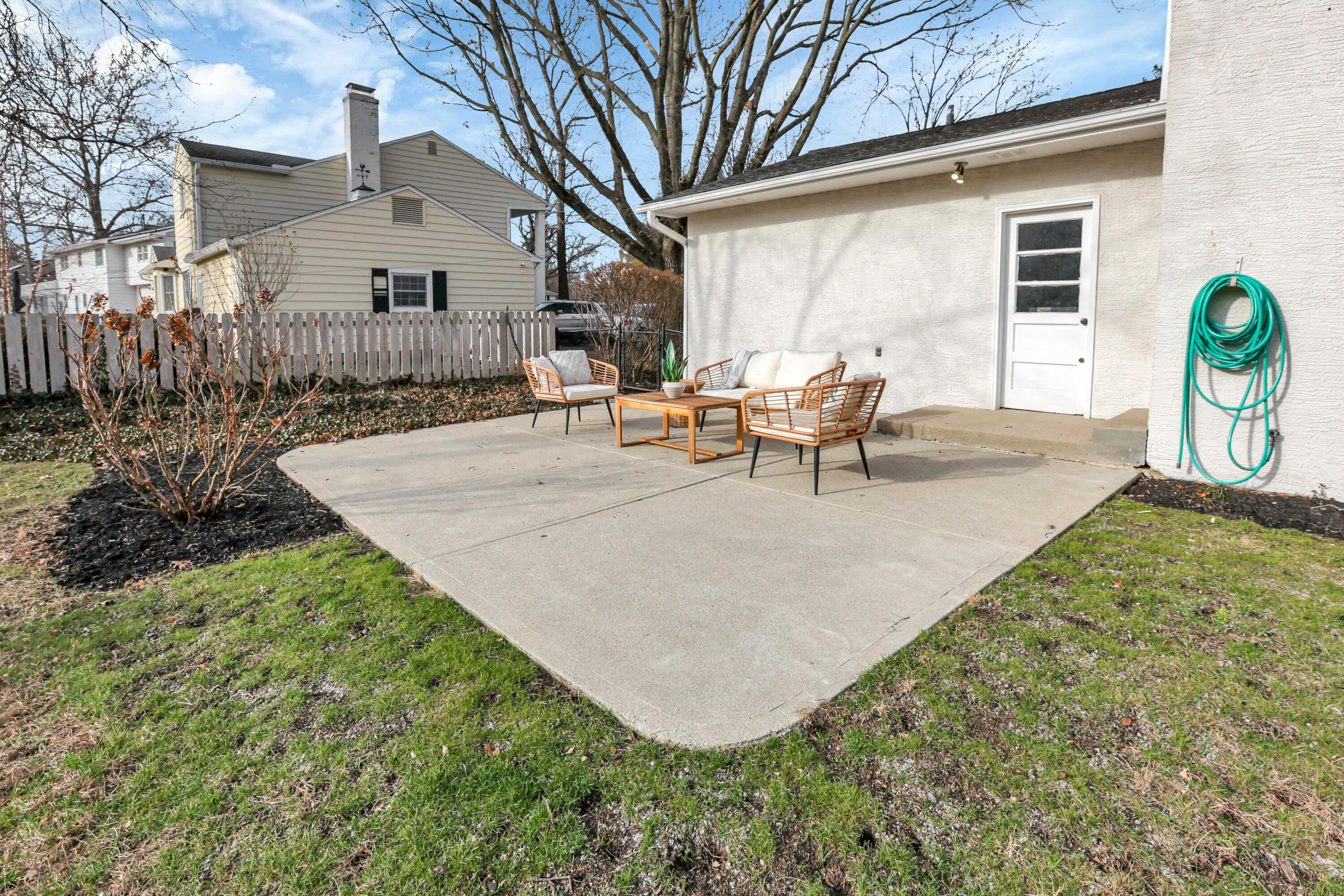 2275 Haverford Road Columbus, OH 43220 - Photo 45 of 57 The concrete patio overlooks the beautifully landscaped, fenced yard.