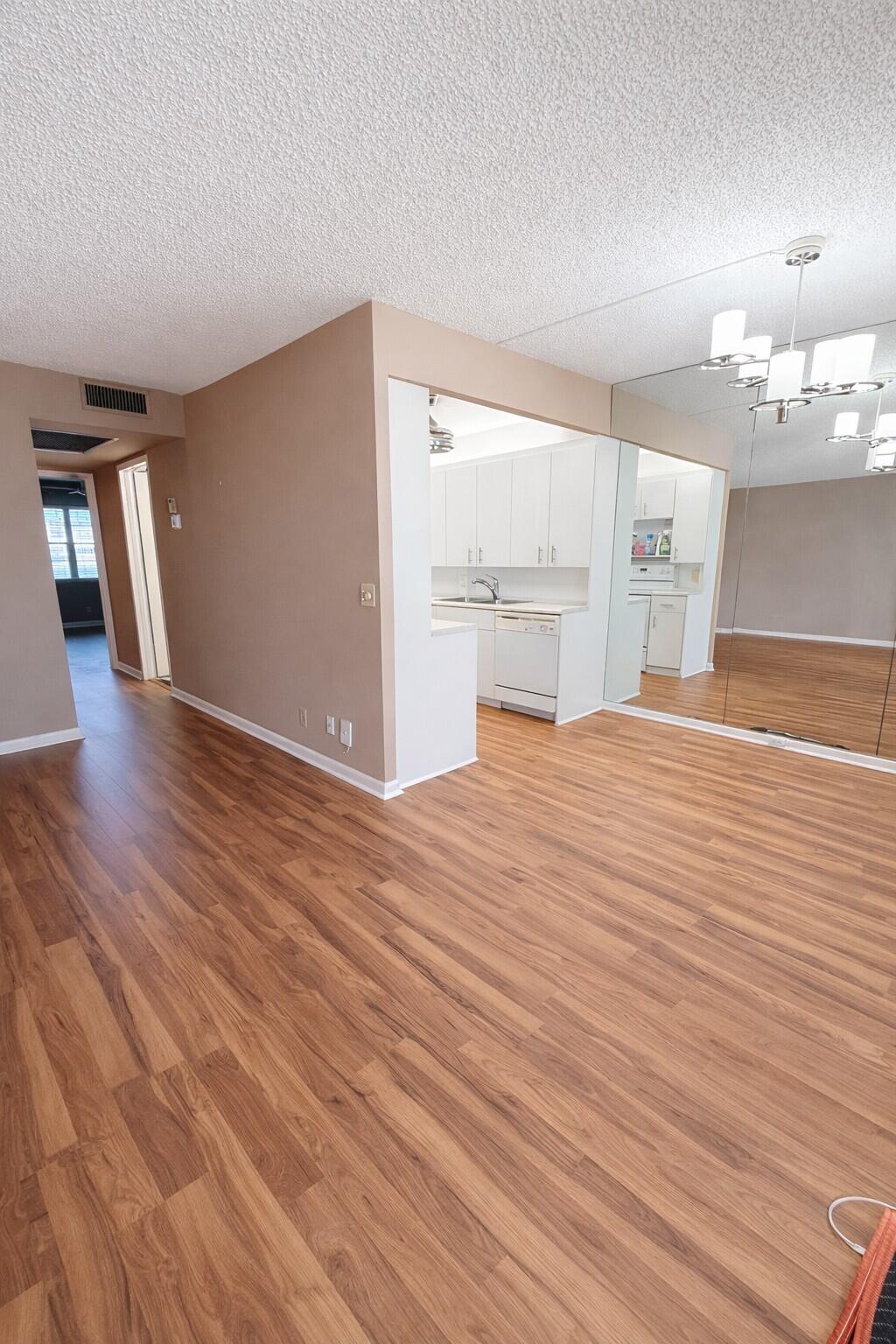 1071 Exeter Boca Raton, FL 33434 - Photo 3 of 13 a view of a livingroom with wooden floor