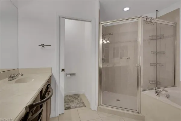 a bathroom with a shower and a sink