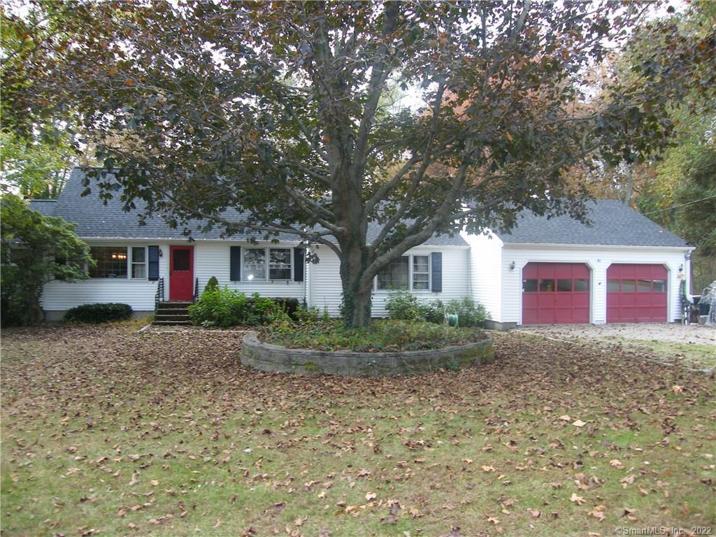 51 Cow Hill Road Clinton, CT 06413 - Photo 1 of 1 a view of a yard in front of a house with large windows