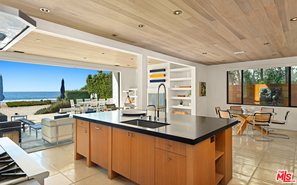 31240 Broad Beach Road Malibu, CA 90265 - Photo 22 of 54 a open kitchen with stainless steel appliances granite countertop a sink and cabinets