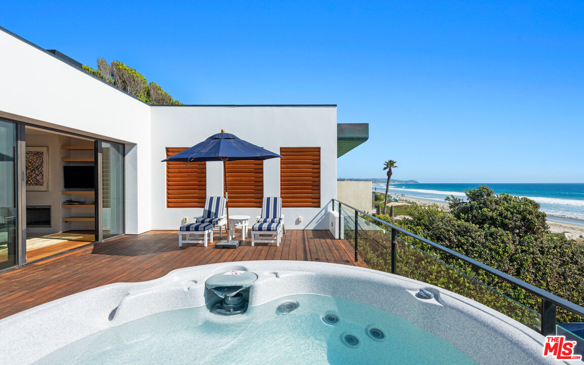 31240 Broad Beach Road Malibu, CA 90265 - Photo 29 of 54 a swimming pool with outdoor seating